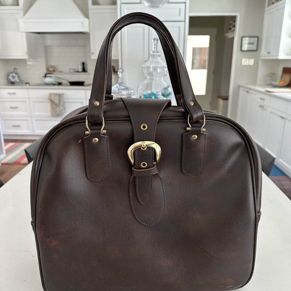 American Tourister Faux leather carry-on bag.